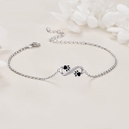 Infinity symbol bracelet with paw print charm and zirconia