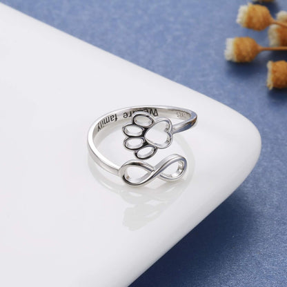 Handmade heart-shaped ring with paw print in sterling silver and adjustable