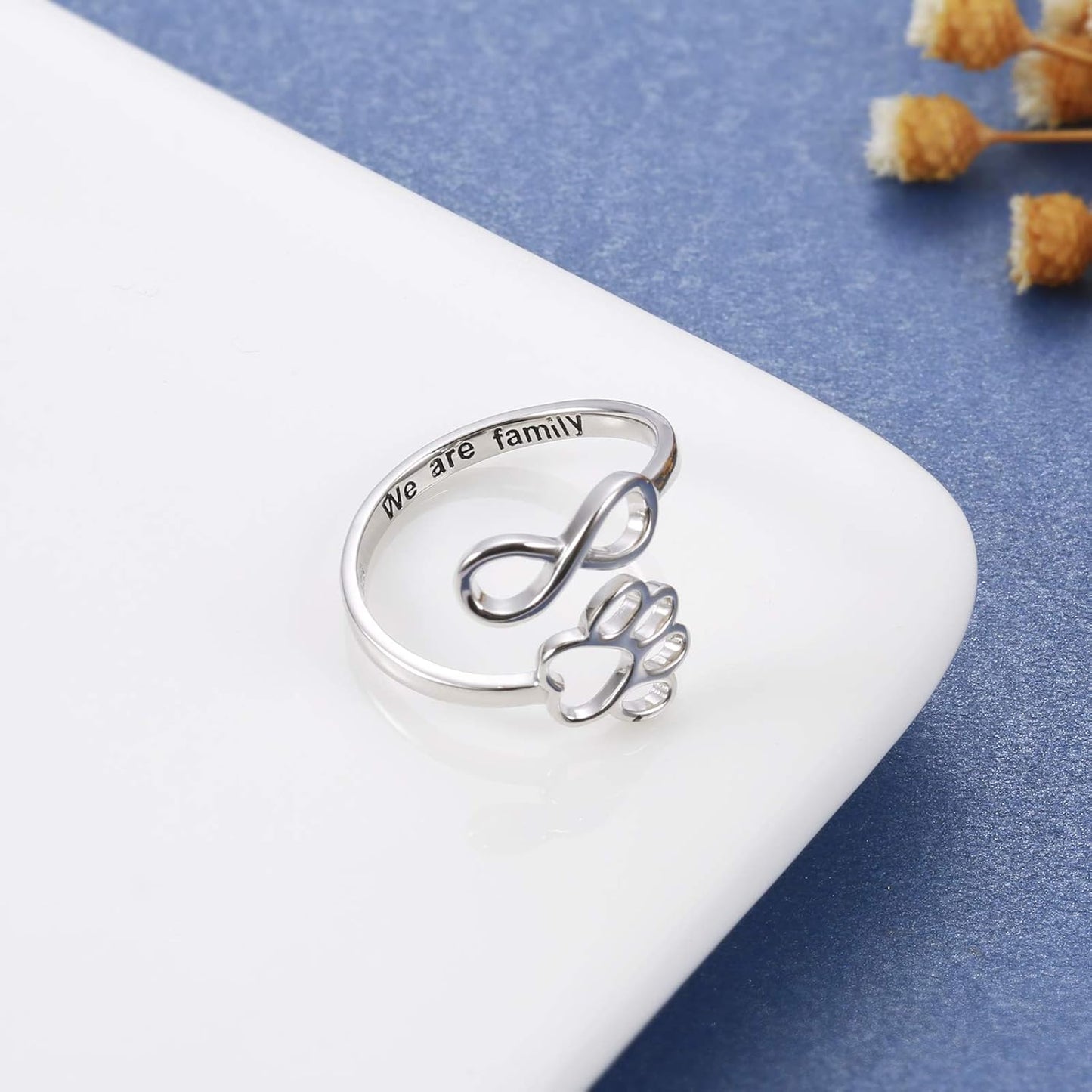 Handmade heart-shaped ring with paw print in sterling silver and adjustable