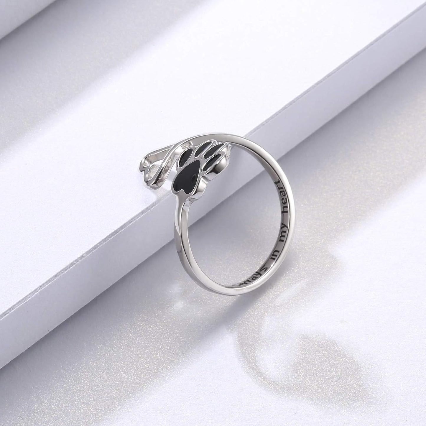 Handmade heart-shaped ring with paw print in sterling silver and adjustable