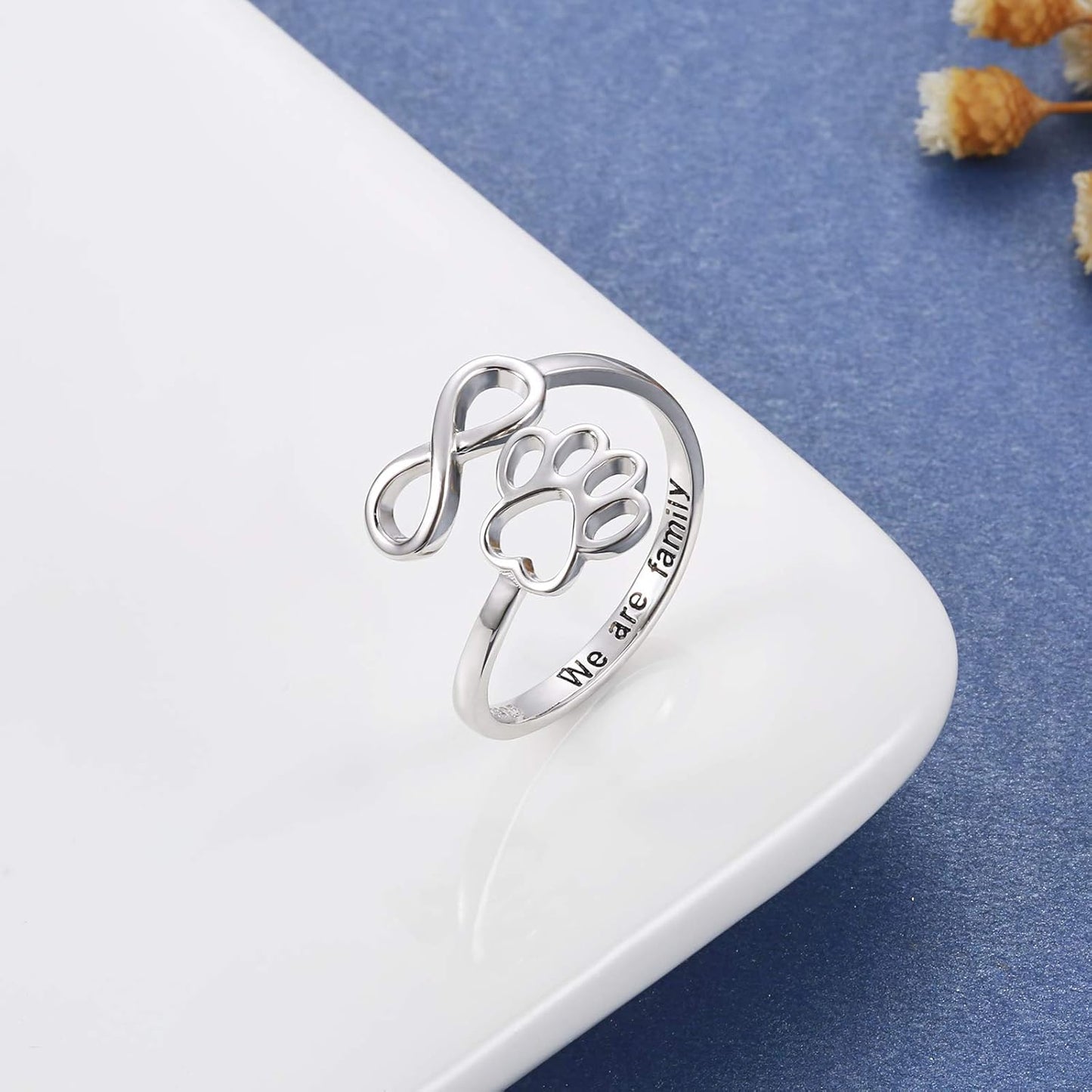 Handmade heart-shaped ring with paw print in sterling silver and adjustable