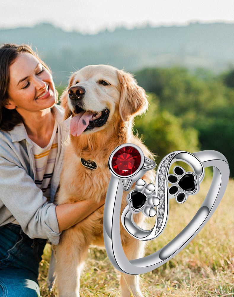 Adjustable Ring with Black Paw Prints and Red Gemstone