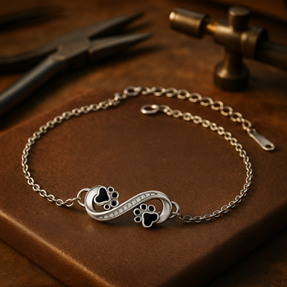 Infinity symbol bracelet with paw print charm and zirconia