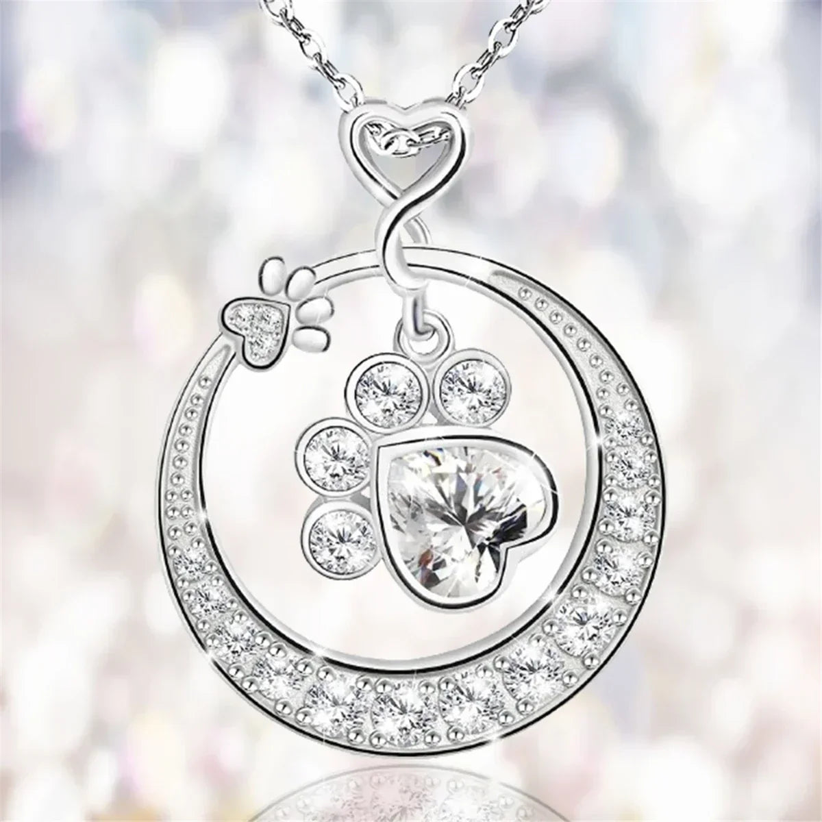 Charming silver paw print necklace with zirconia