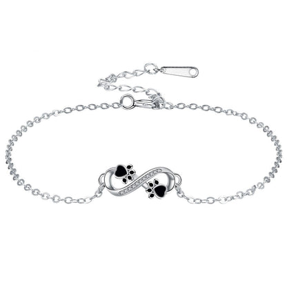 Infinity symbol bracelet with paw print charm and zirconia