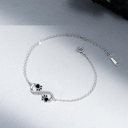 Infinity symbol bracelet with paw print charm and zirconia