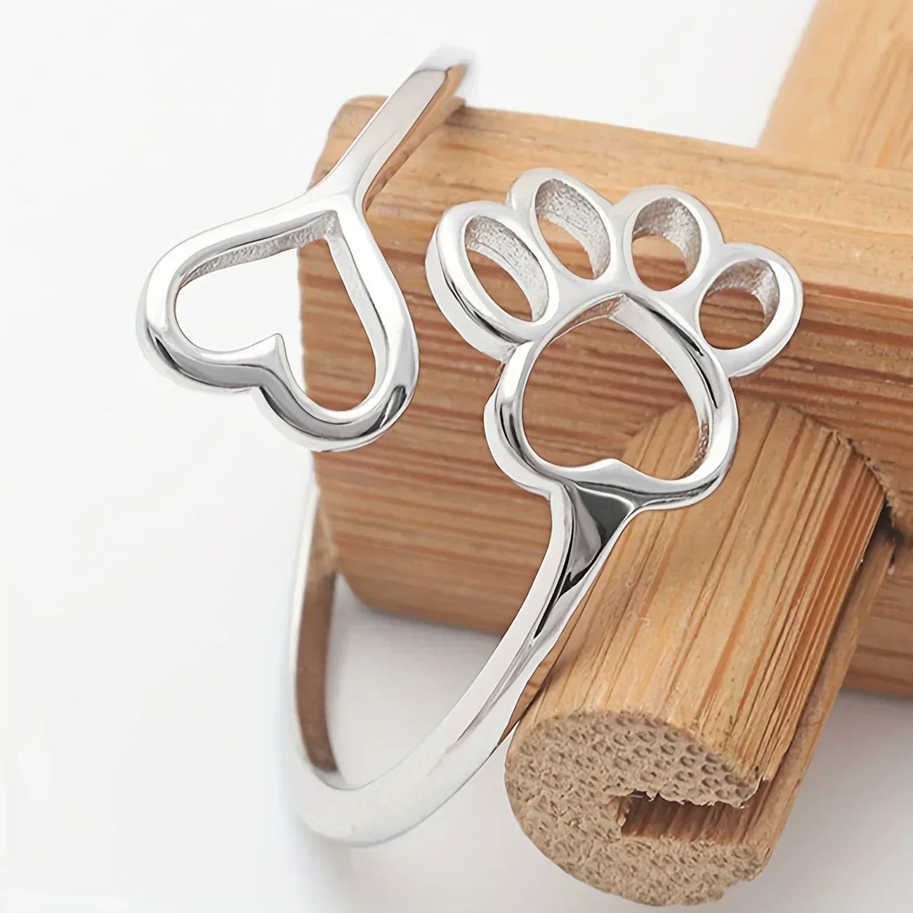 Handmade heart-shaped ring with paw print in sterling silver and adjustable