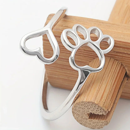 Handmade heart-shaped ring with paw print in sterling silver and adjustable